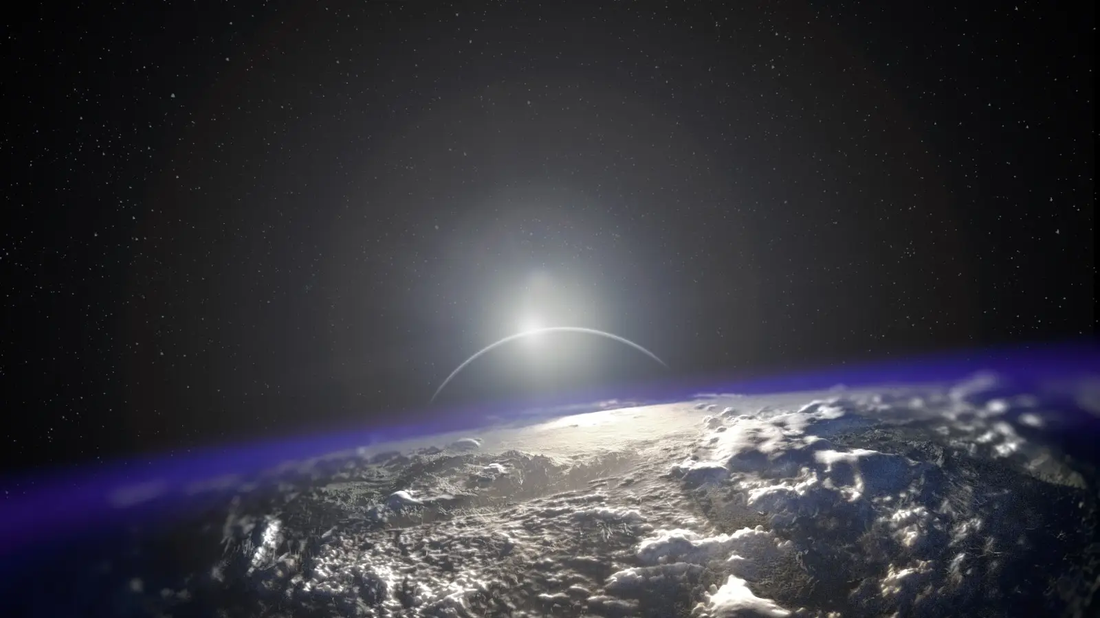 Sunrise breaking over the curve of the earth, seen from orbit